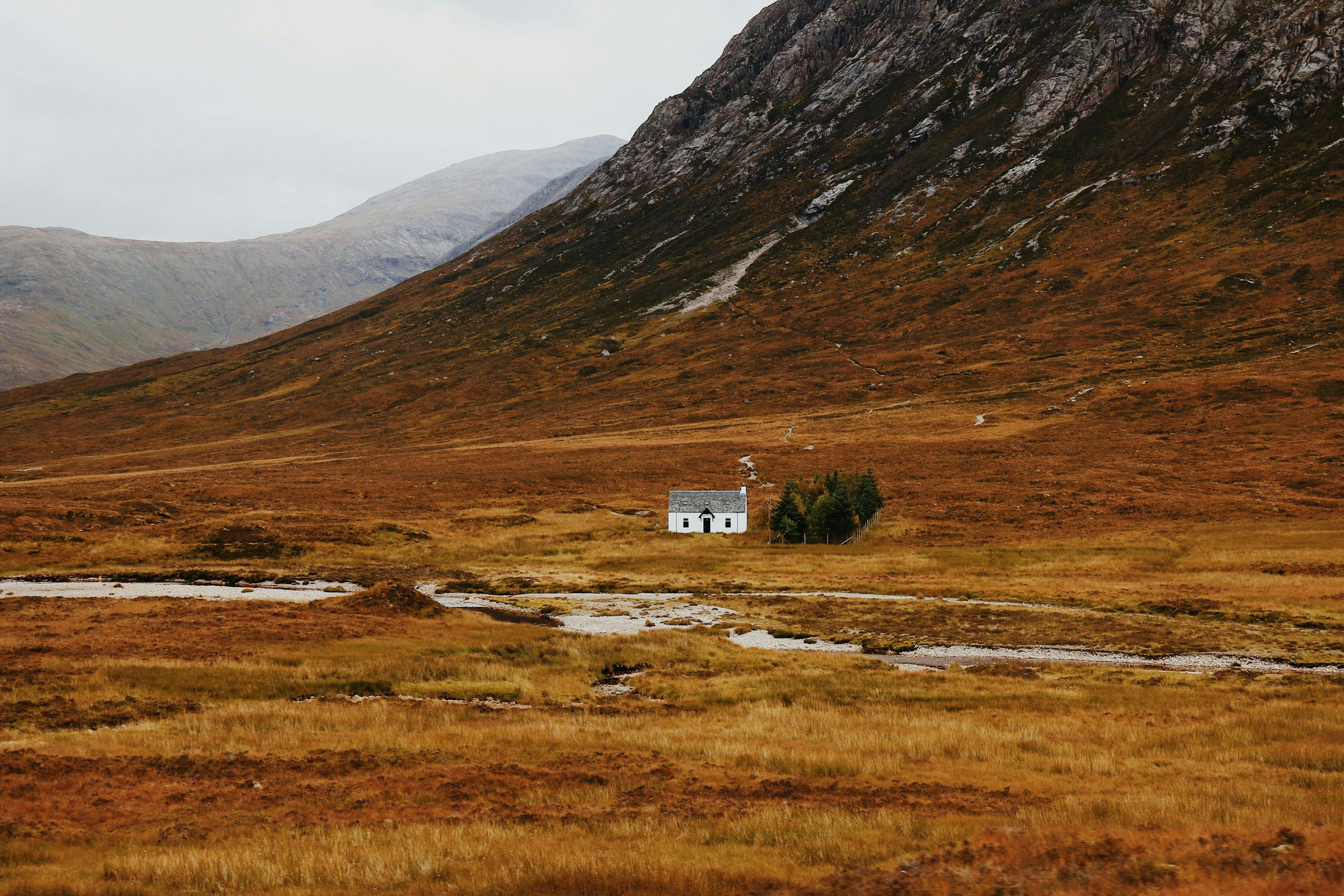 Home in Scottish highlands surrounded by mountains