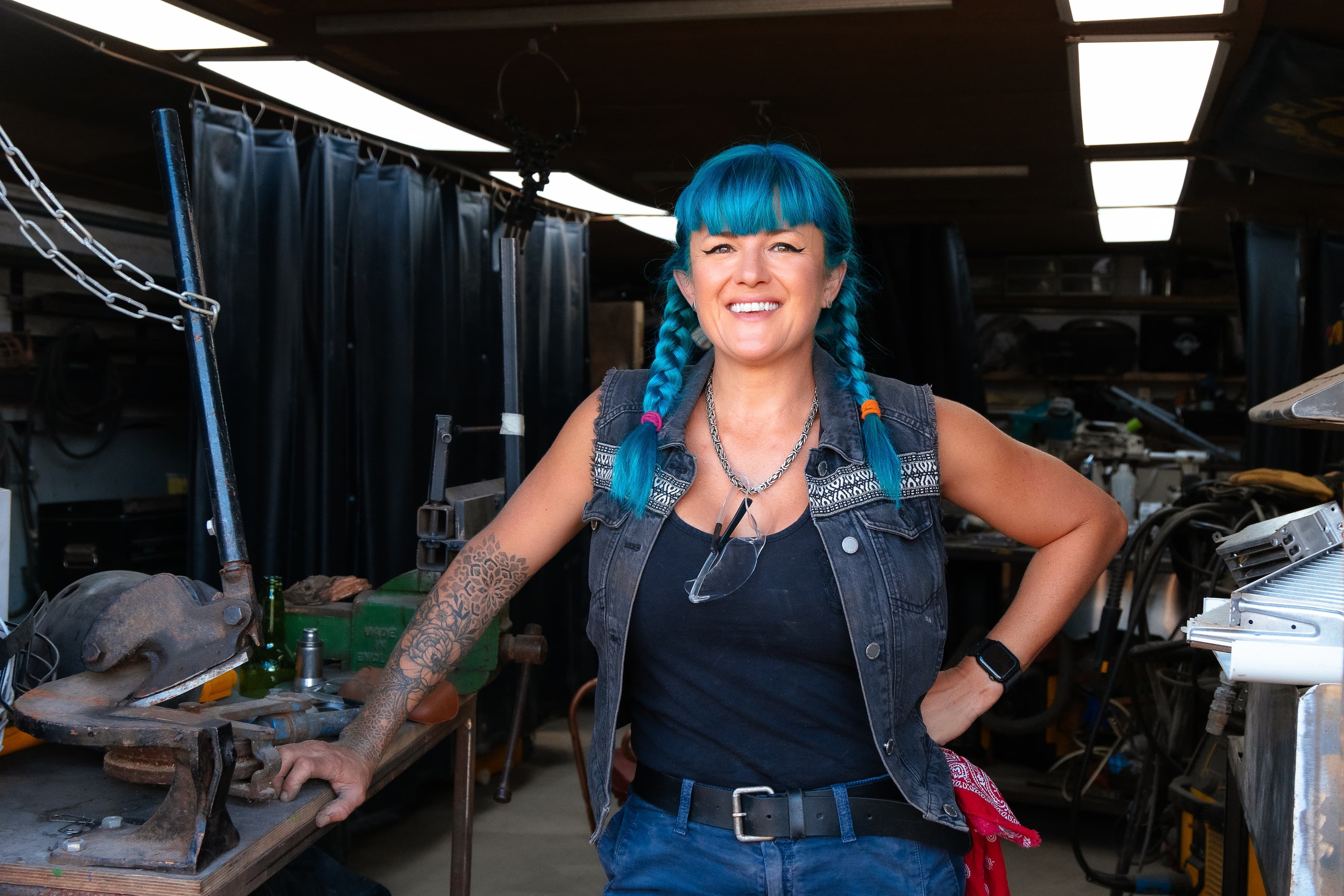 Charis Williams, The Salvage Sister, posing in front of The Salvage Sister Workshop