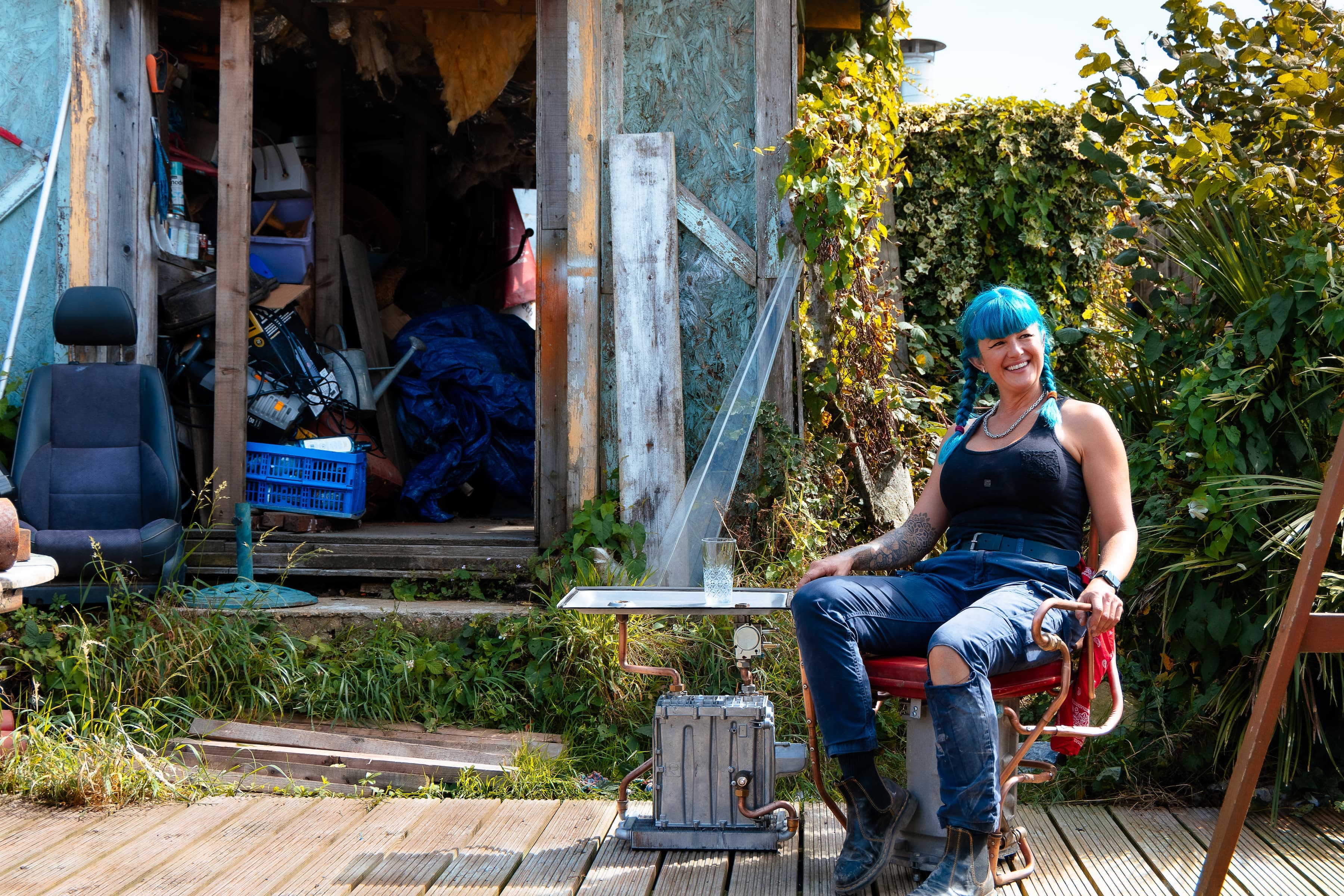Charis Williams, The Salvage Sister, posing in front of The Salvage Sister Workshop