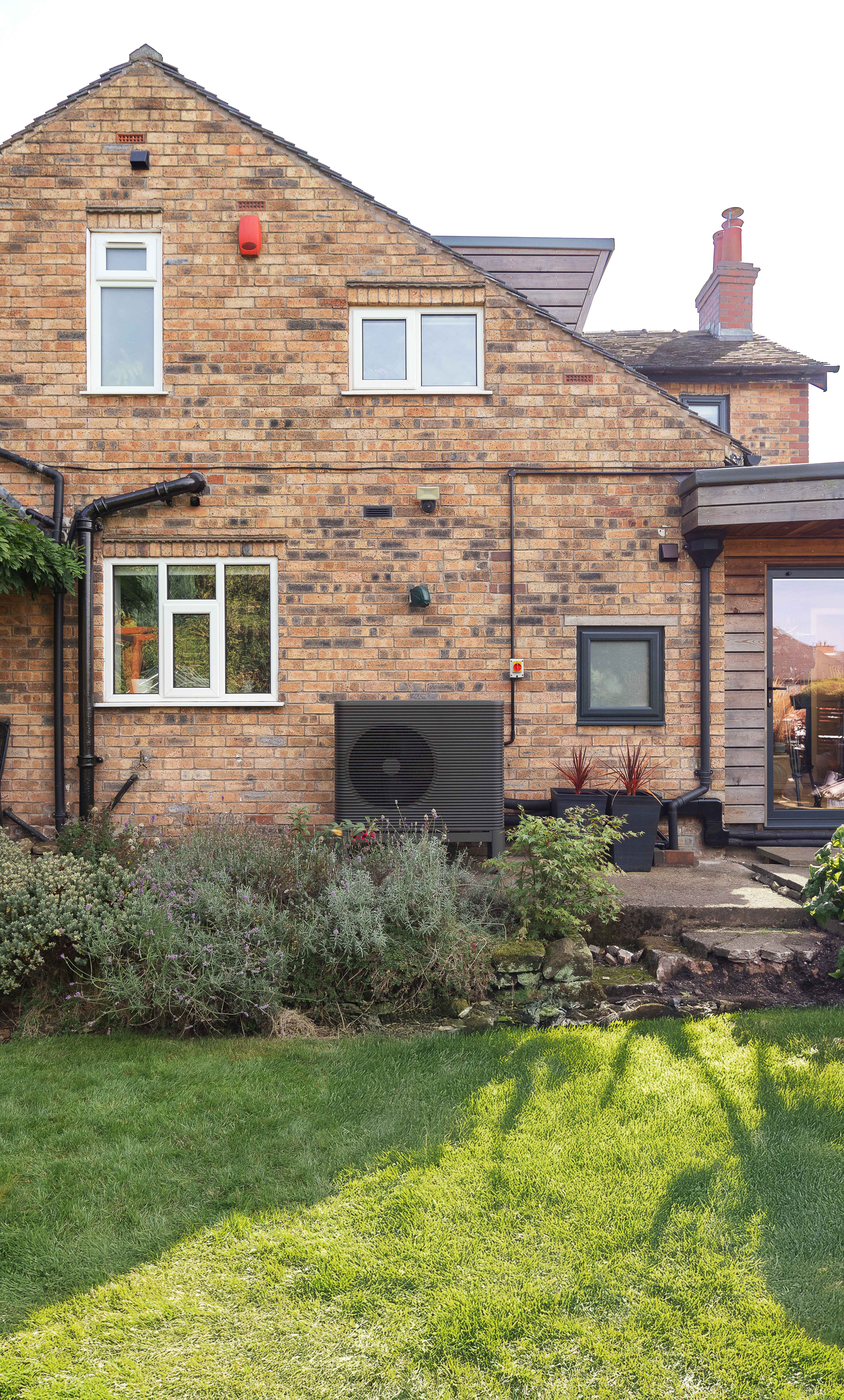 The outside of a home with an Aira Heat Pump outside
