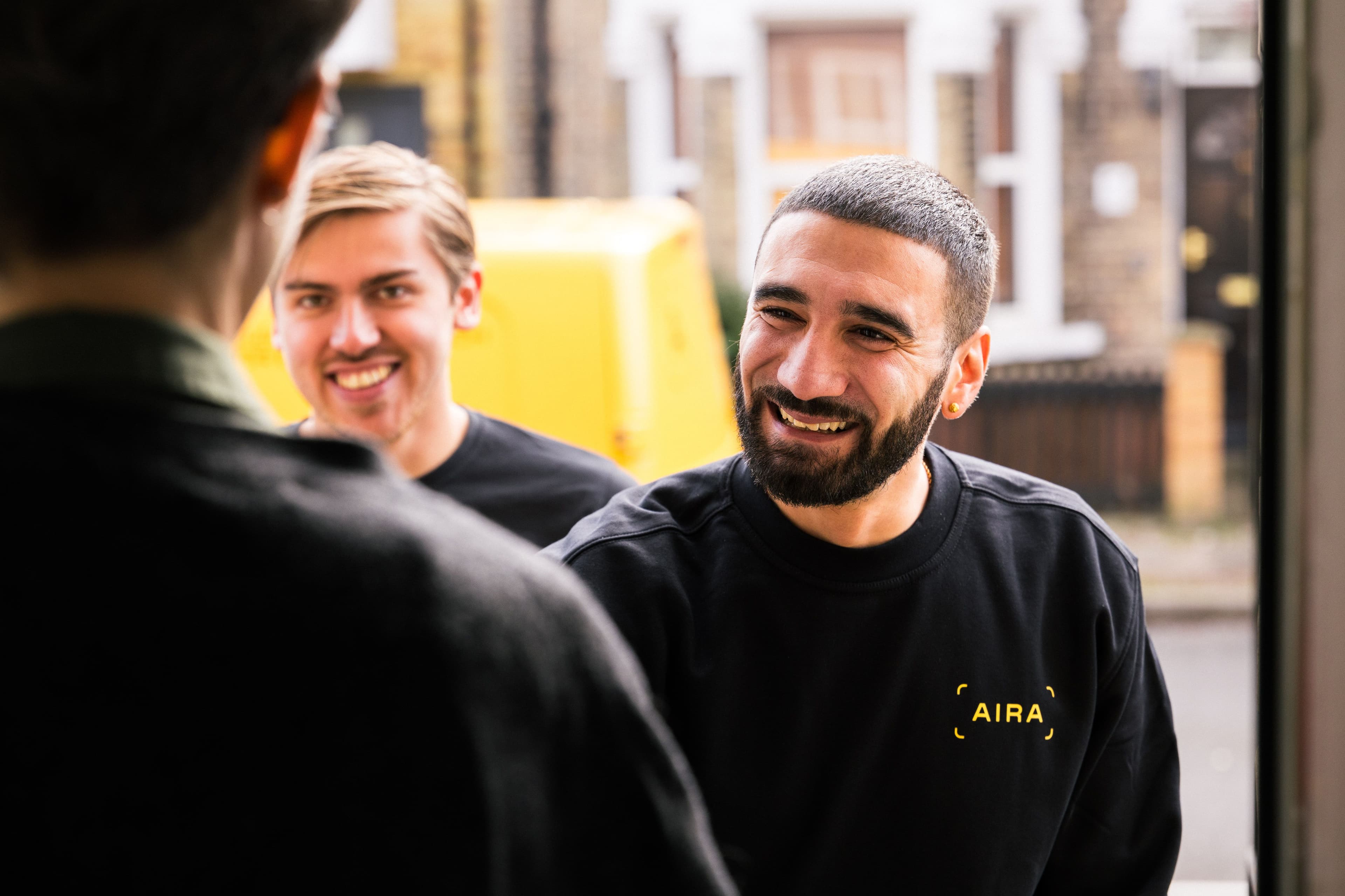 Aira Technicians greeting customer before installing a heat pump