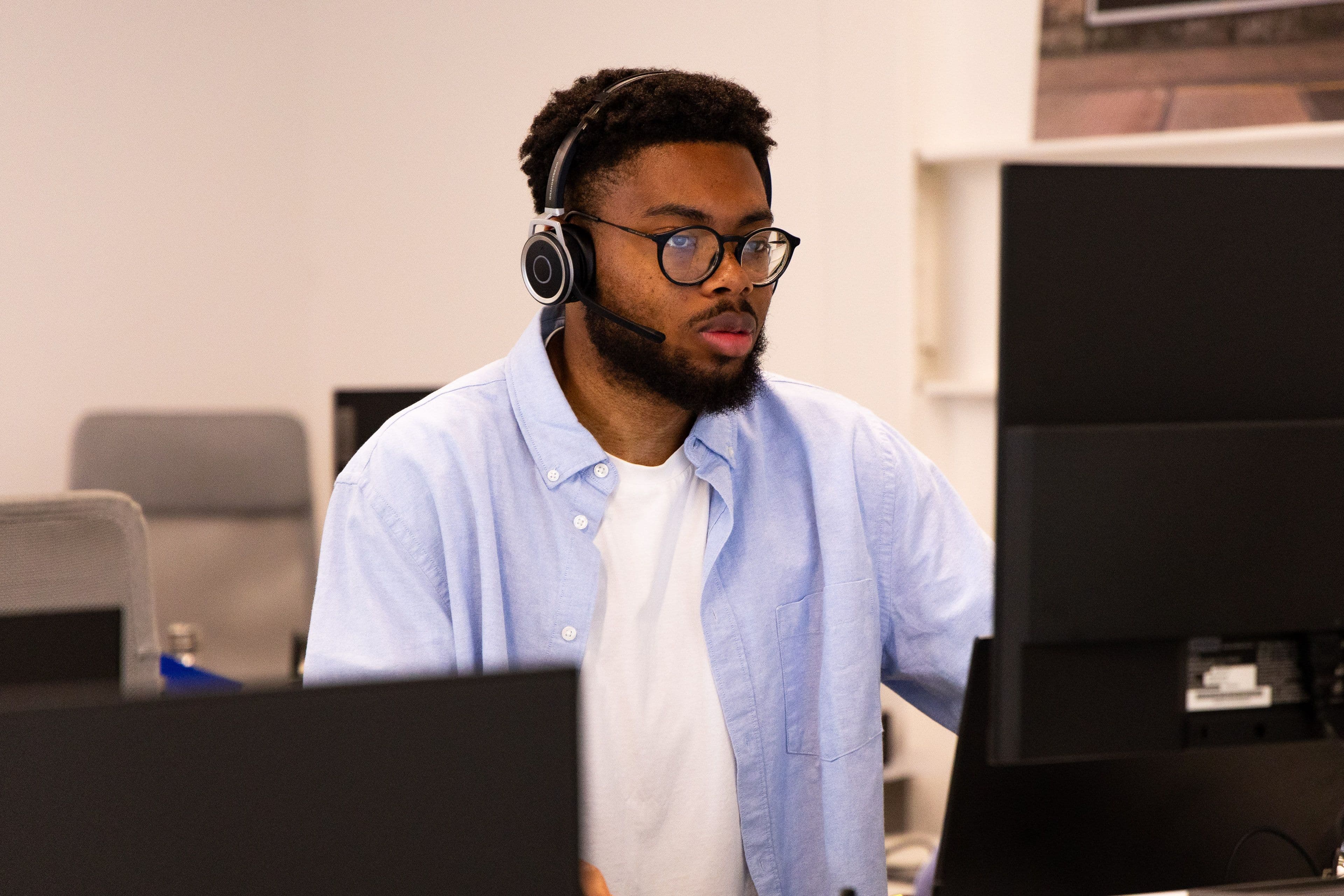 An Aira employee answering calls 