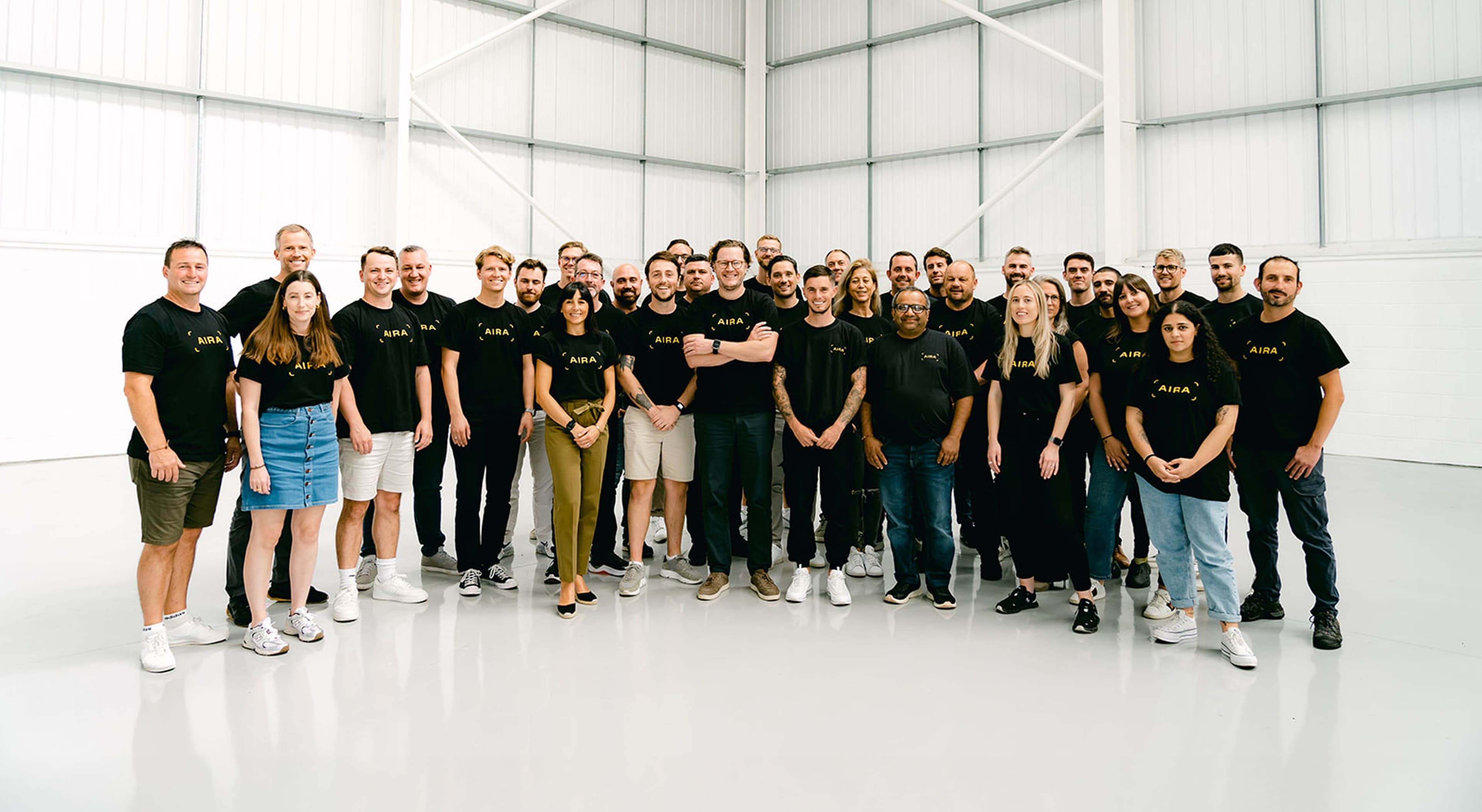A group of Aira employees standing in a hub