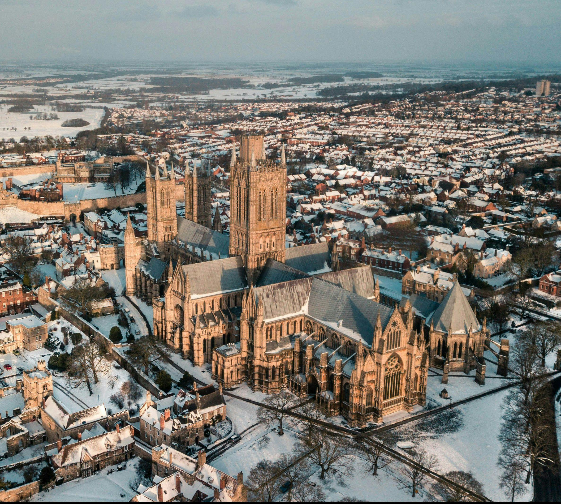 Aerial view of Lincoln Cathedral in Lincolnshire, with snow on the ground