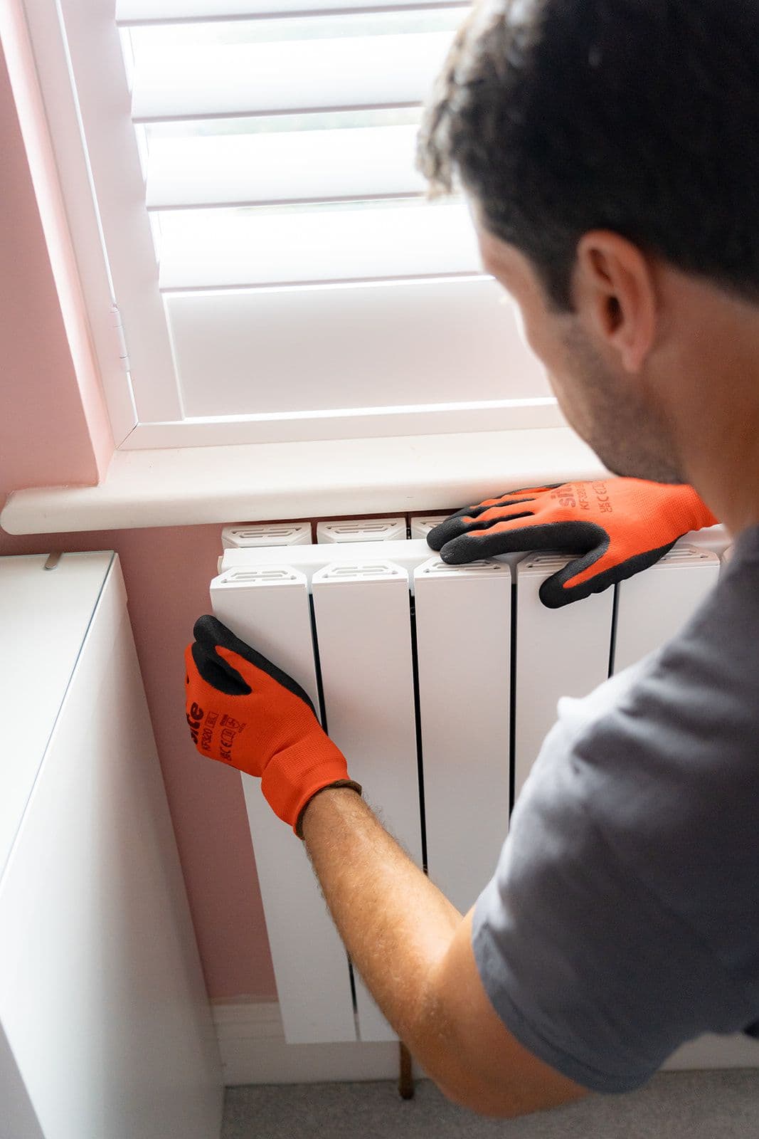 Close up of a new radiator being installed by an Aira Clean Energy Technician