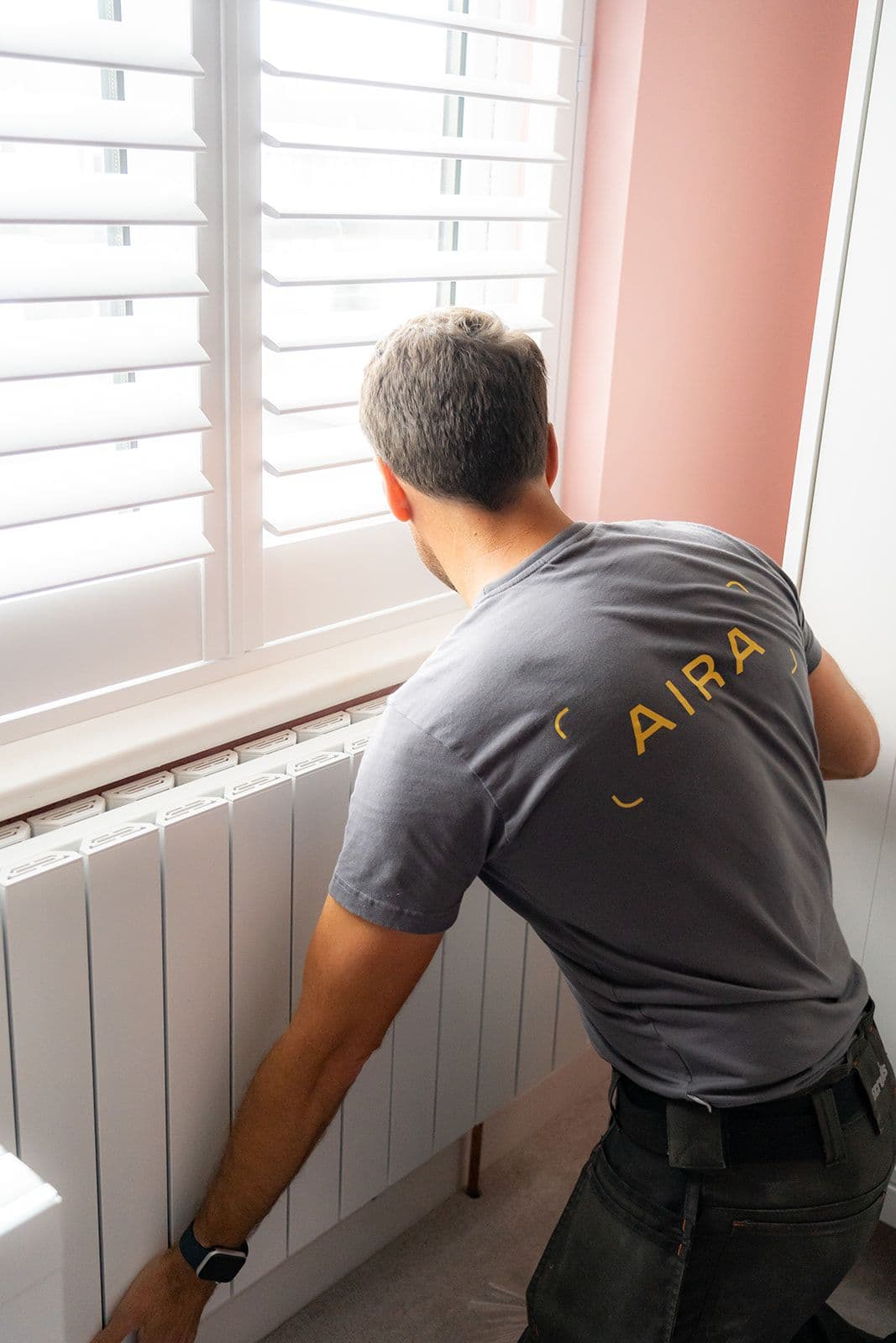 A new radiator being installed by an Aira Clean Energy Technician