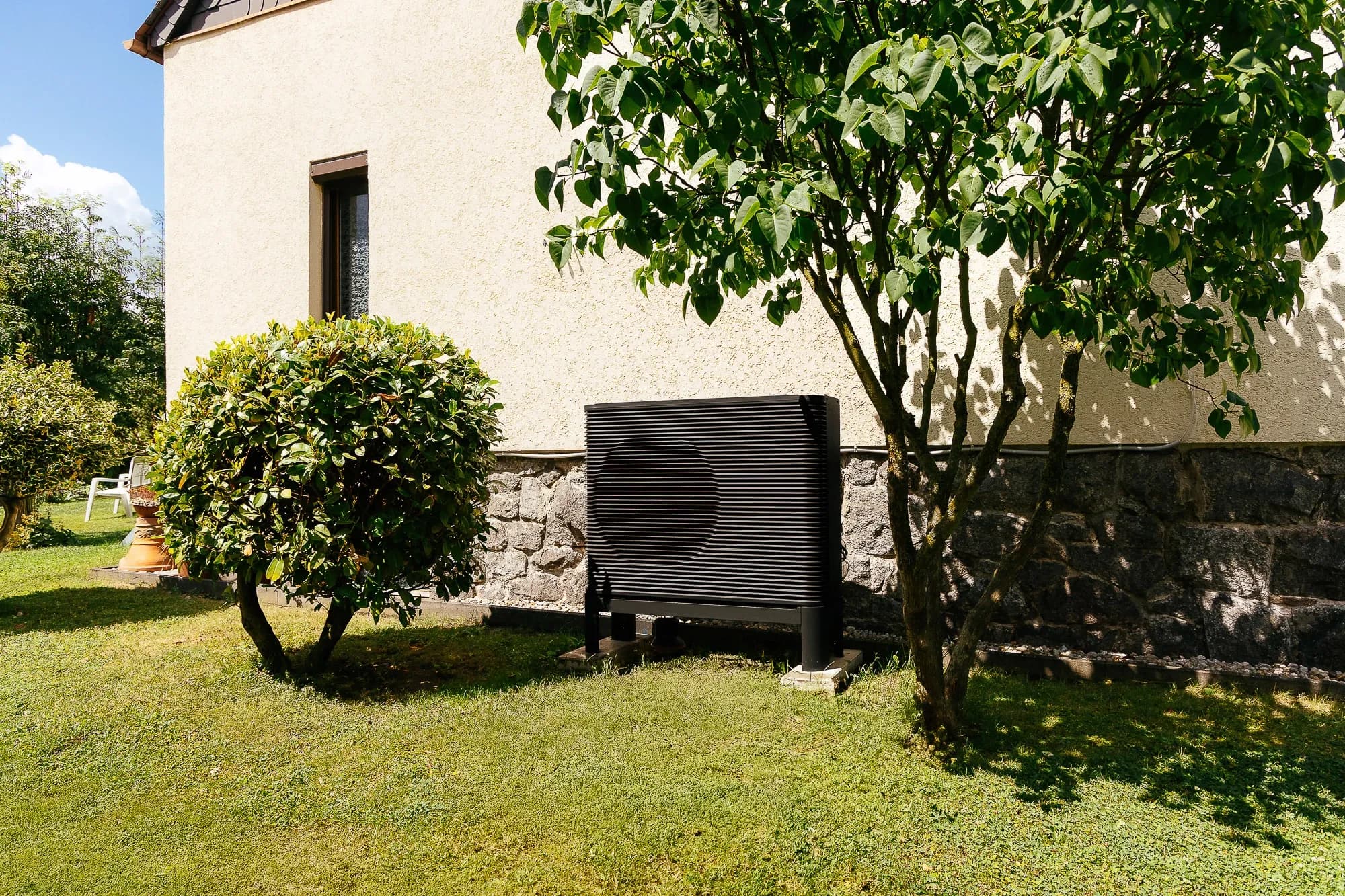 An outdoor unit placed in the garden in Germany